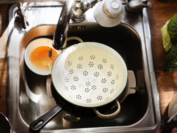 You live with a room mate who won't clean her dishes. How do you deal with this?