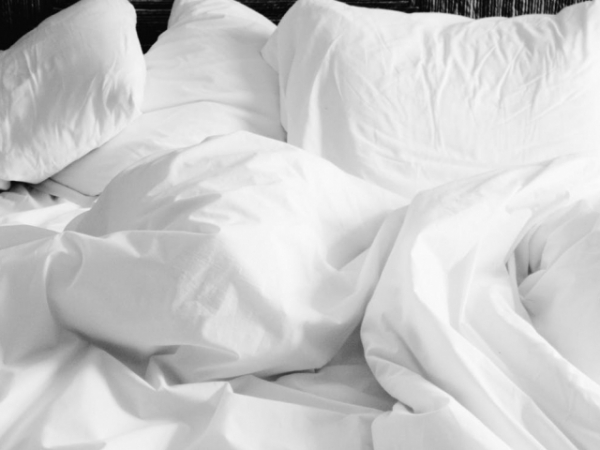Do you sleep with your sheets tucked in or out?